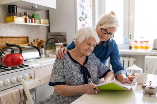 elderly and caregiver in the kitchen