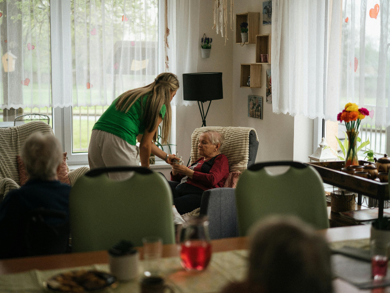 elderly in there home, sitting on a chair