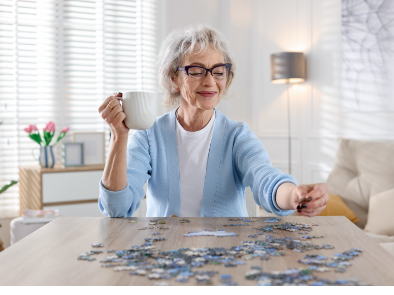 elderly women doing a puzzle