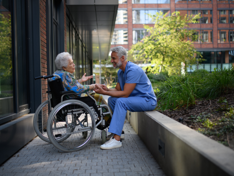 elder and caregiver speaking