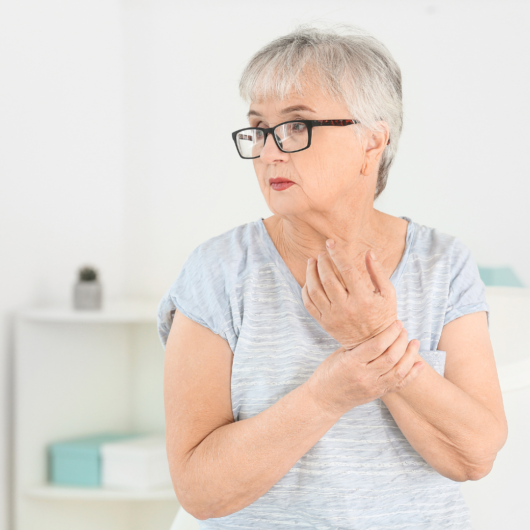 Senior woman suffering from pain in hand