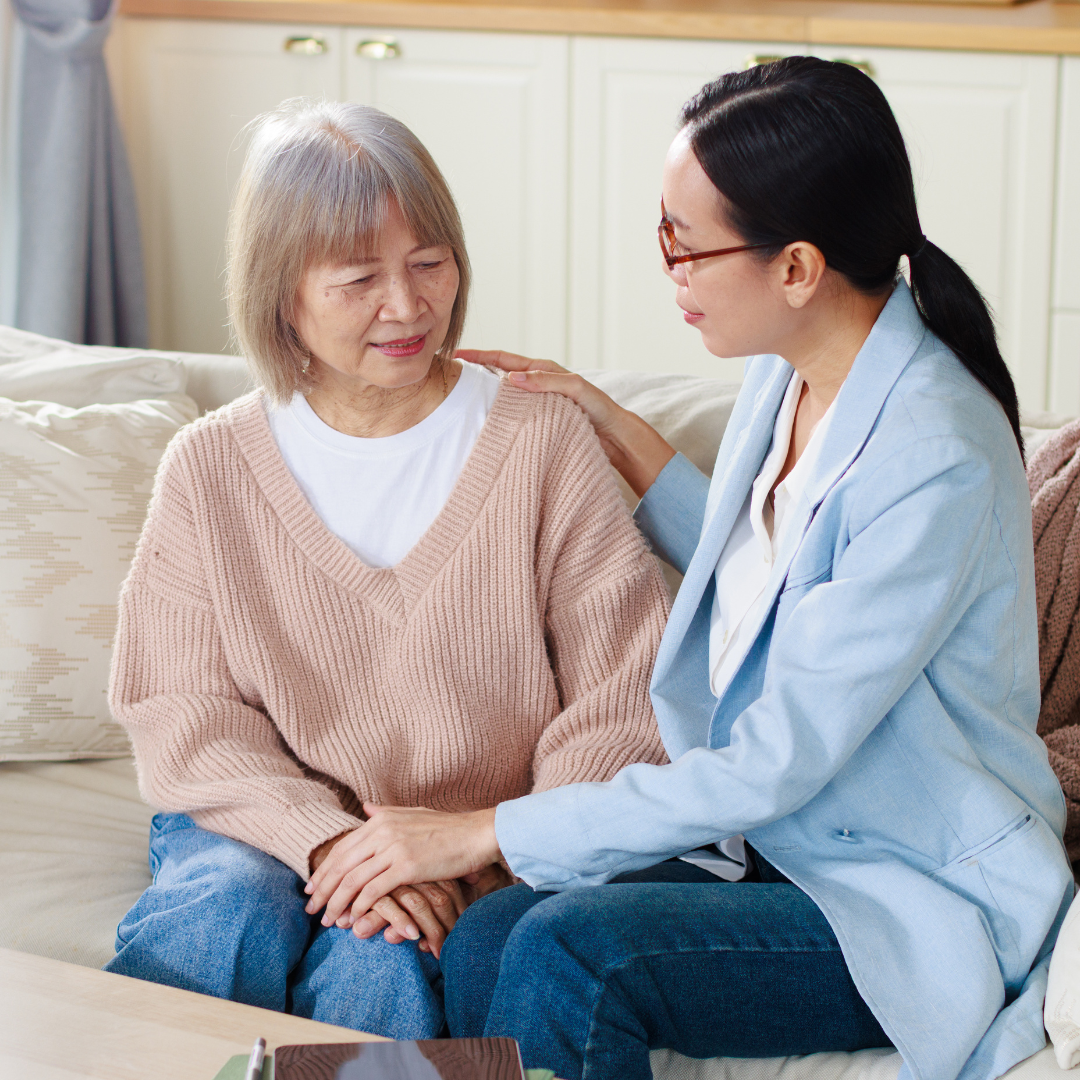 Caregiver assisting senior woman